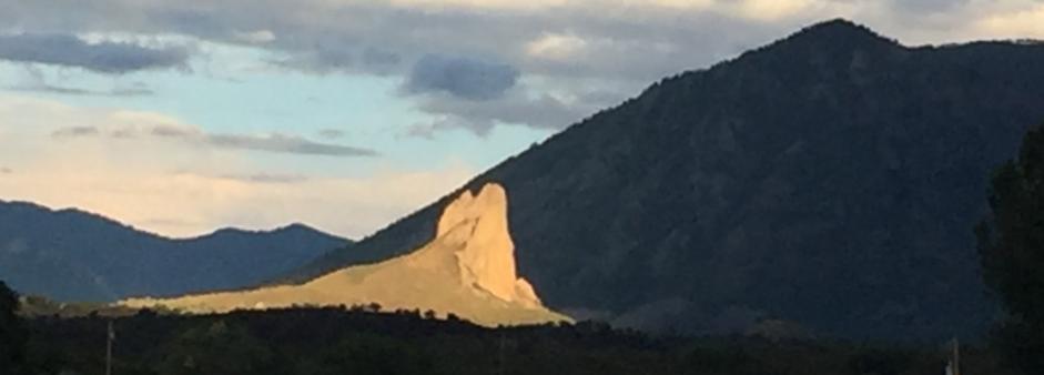 Needlerock in bright white sun among shadows