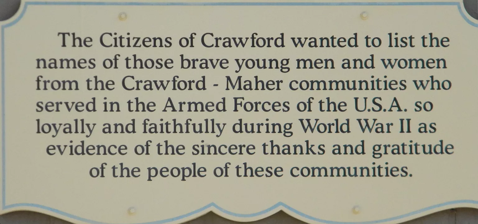 Sign that reads: The Citezens of Crawford wanted to list the names of those brave men and women from the Crawford - Maher communities who served in the Armed Forces of the USA so loyally and faithfully during World War two as evidence of the sincere thanks and gratitude of the people of these communities.