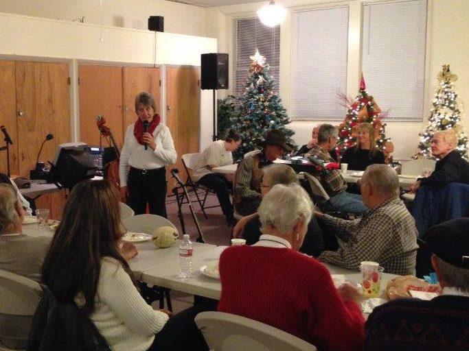 People sitting at tables during the festival of trees